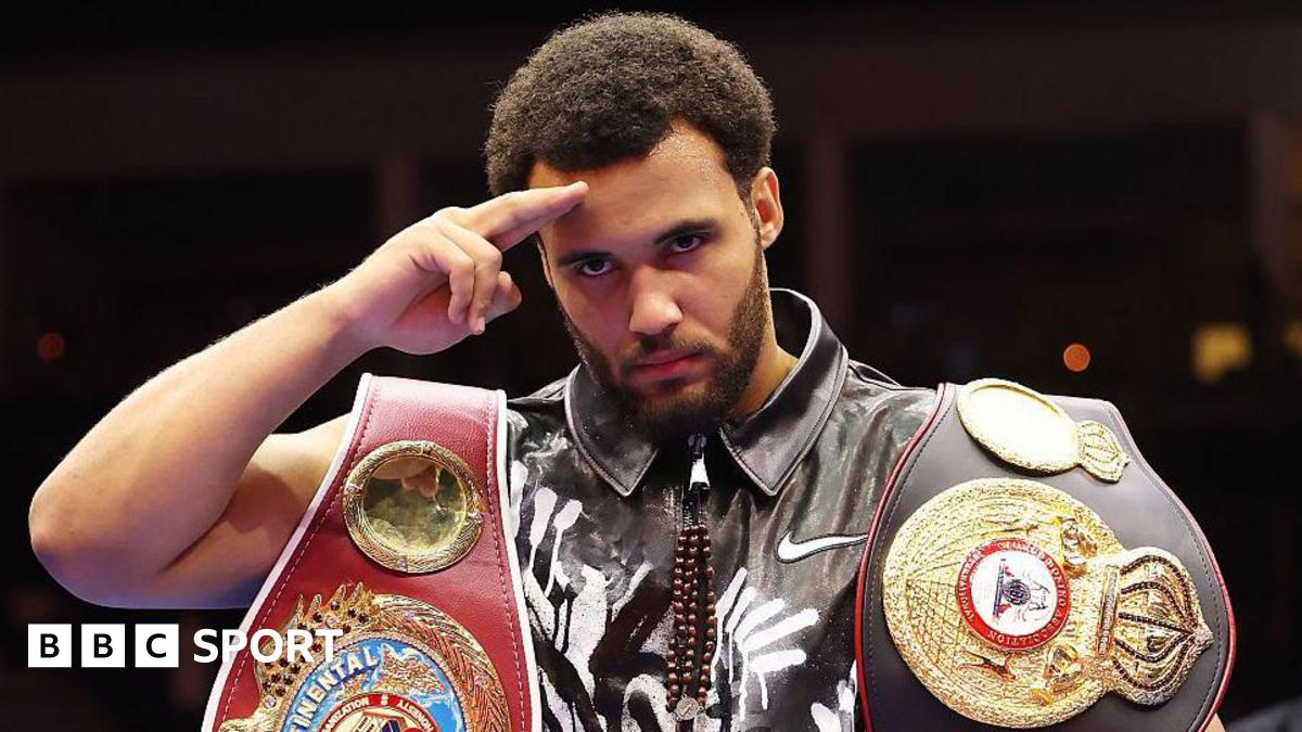 Moses Itauma salutes the cameras holding his belts