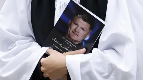 Reuters A view of the order of service at the funeral of the former boxer. It reads: "A service of thanksgiving". 