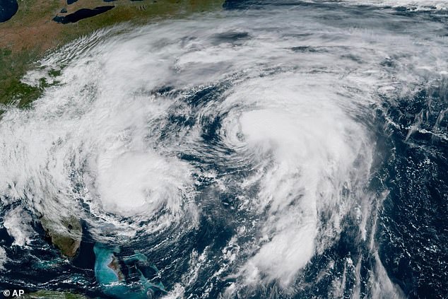 A satellite image shows Hurricane Imelda (left) and Humberto (right) in the Atlantic yesterday