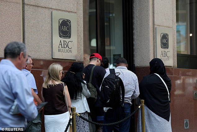 People queue outside the ABC Bullion store as gold hit a record price this week