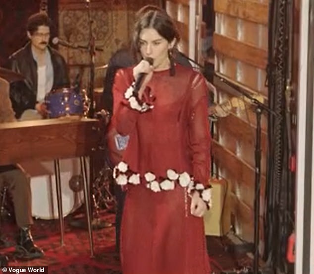 The British-born star could be seen wearing a snakeskin dress that was secured with a belt around her midriff