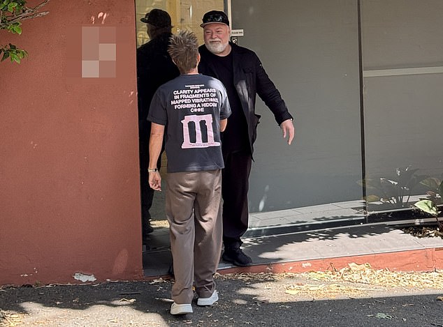 The pair could be seen greeting each other with a handshake and leaning in for a hug before heading indoors together.