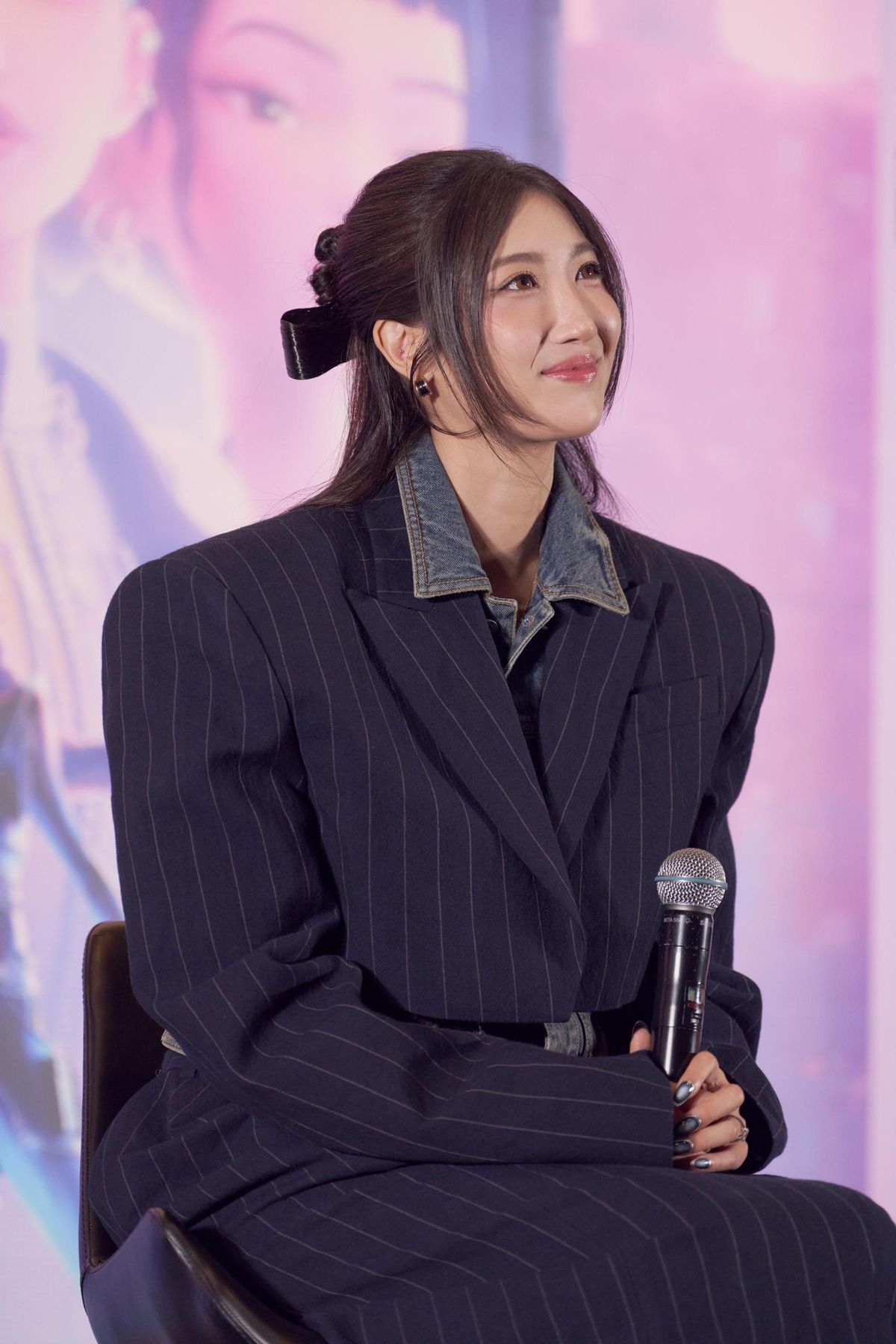 EJAE, the composer and vocalist of the globally popular song “Golden” from the Netflix animated film “KPop Demon Hunters,” attends a press conference at a theater in Seoul, Wednesday. Courtesy of Netflix