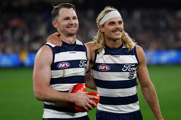 Cats captain Patrick Dangerfield with Bailey Smith.