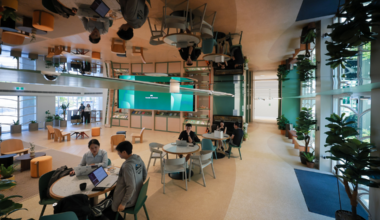 A walkway with a mirrored ceiling connects the interior spaces of the newly renovated Temasek Shophouse.