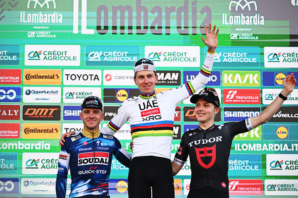 BERGAMO, ITALY - OCTOBER 11: (L-R) Remco Evenepoel of Belgium and Team Soudal Quick-Step on second place, race winner Tadej Pogacar of Slovenia and Team UAE Team Emirates and Michael Storer of Australia and Team Tudor Pro Cycling on third place pose on the podium ceremony after the 119th Il Lombardia 2025 a 241km one day race from Como to Bergamo on October 11, 2025 in Bergamo, Italy. (Photo by Dario Belingheri/Getty Images)