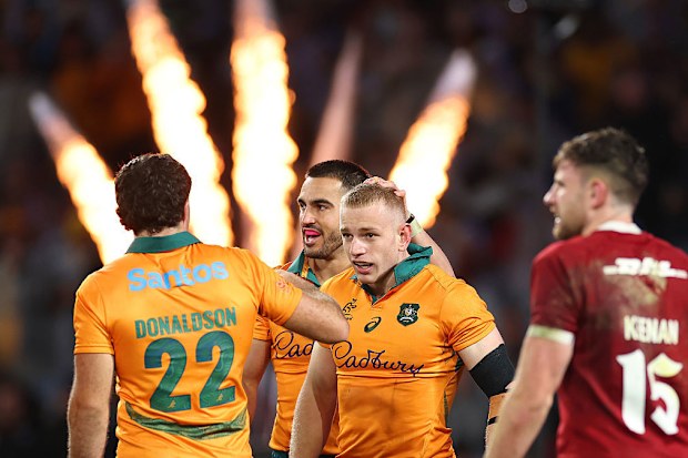 Max Jorgensen of the Wallabies celebrates after scoring a try.