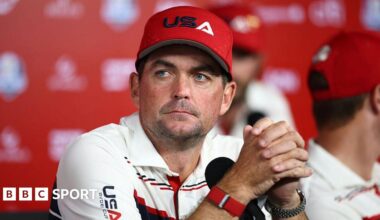Keegan Bradley with his hands interlinked, staring into the distance
