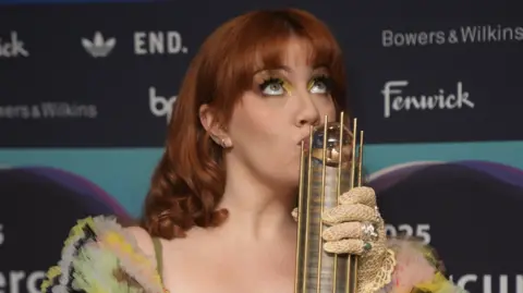 PA Media Cmat with her Mercury Prize