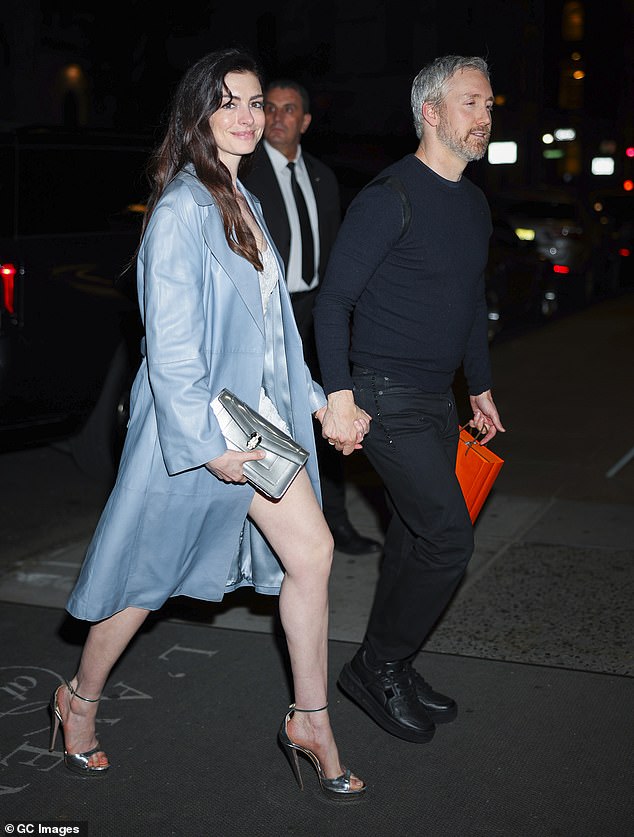 Anne recently insisted that despite her global fame she is a regular person, who loves to stay home with her family (Seen with Adam in April)