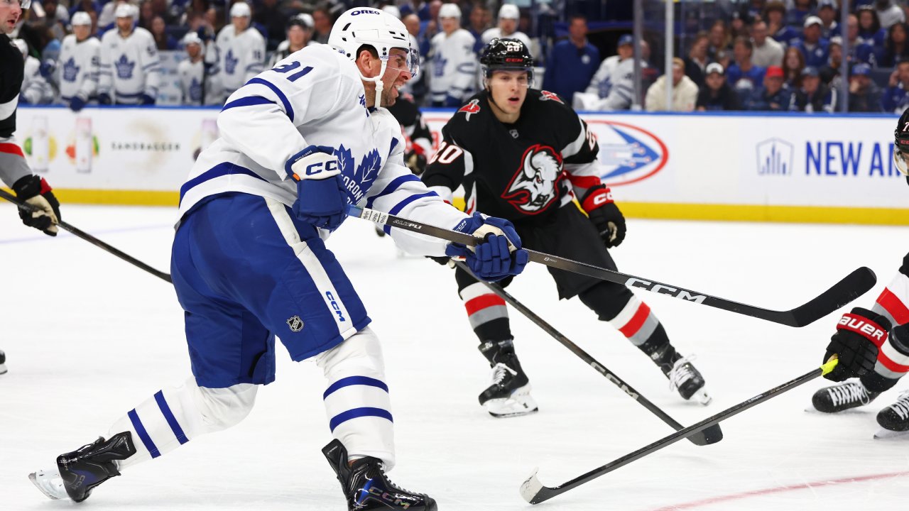 Maple Leafs and Sabres players sport Blue Jays jerseys during walk-ins