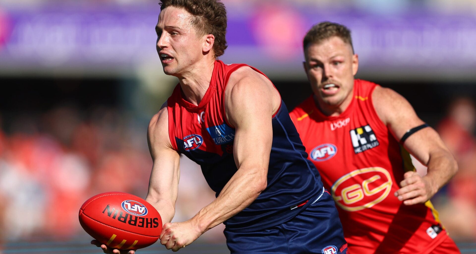 GOLD COAST, AUSTRALIA - AUGUST 17: Jack Billings of the Demons in action during the round 23 AFL match between Gold Coast Suns and Melbourne Demons at People First Stadium, on August 17, 2024, in Gold Coast, Australia. (Photo by Chris Hyde/Getty Images)