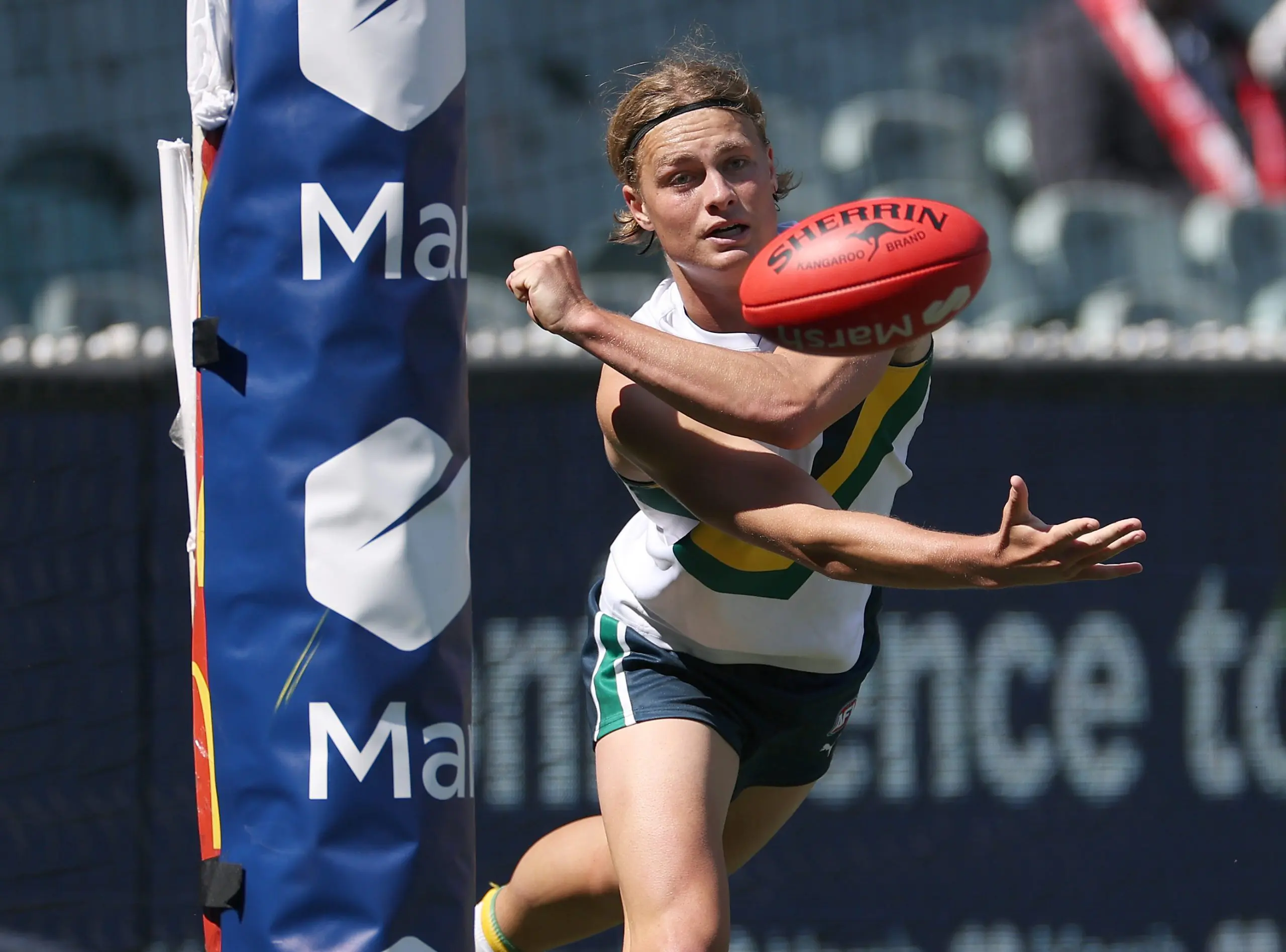 MELBOURNE, AUSTRALIA - SEPTEMBER 28: Jai Murray of Team Sloane handballs during the Marsh AFL National Futures Boys match between Team Heppell and Team Sloane at Melbourne Cricket Ground, on September 28, 2024, in Melbourne, Australia. (Photo by Daniel Pockett/AFL Photos/via Getty Images)