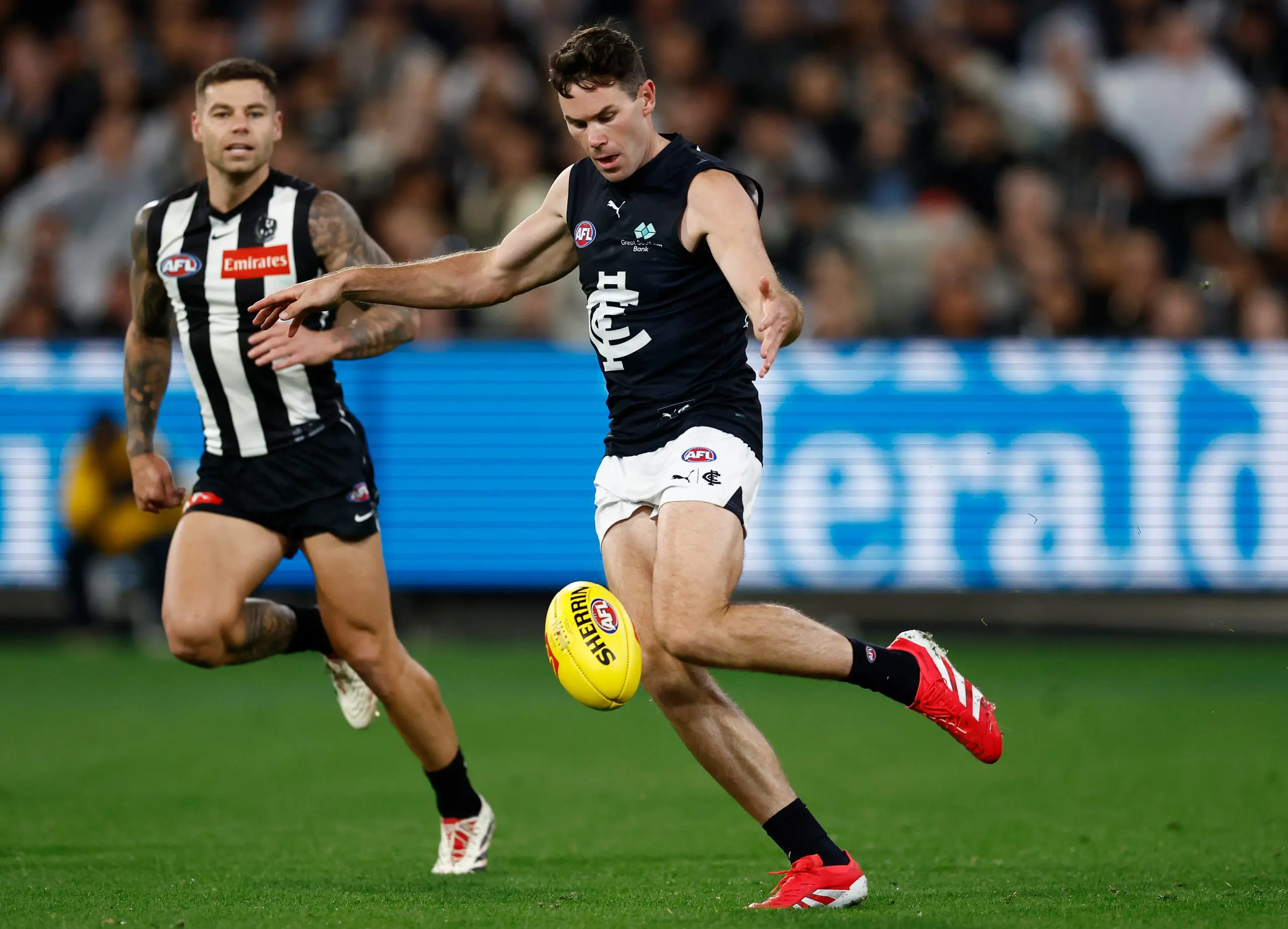 MELBOURNE, AUSTRALIA - APRIL 03: Mitch McGovern of the Blues kicks the ball during the 2025 AFL Round 04 match between the Collingwood Magpies and the Carlton Blues at the Melbourne Cricket Ground on April 3, 2025 in Melbourne, Australia. (Photo by Michael Willson/AFL Photos via Getty Images)