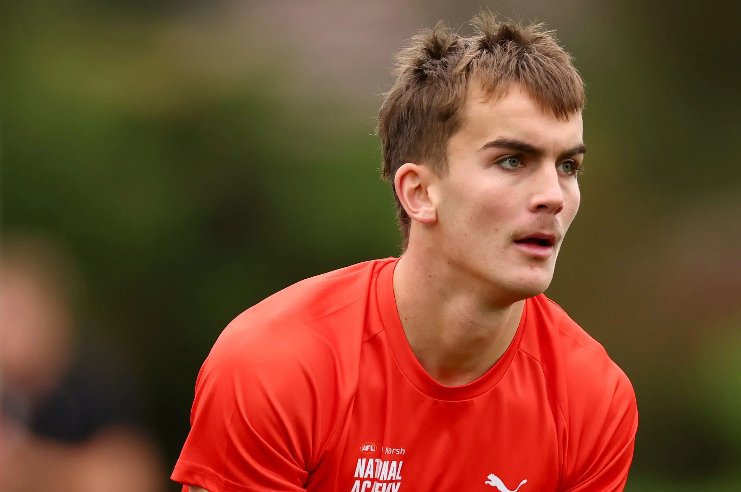 MELBOURNE, AUSTRALIA - APRIL 27: Lachlan Carmichael of the AFL National Academy warms up ahead of the Marsh AFL National Academy Boys match between Australia U18 and Coburg VFL at Whitten Oval on April 27, 2025 in Melbourne, Australia. (Photo by Josh Chadwick/AFL Photos/via Getty Images)