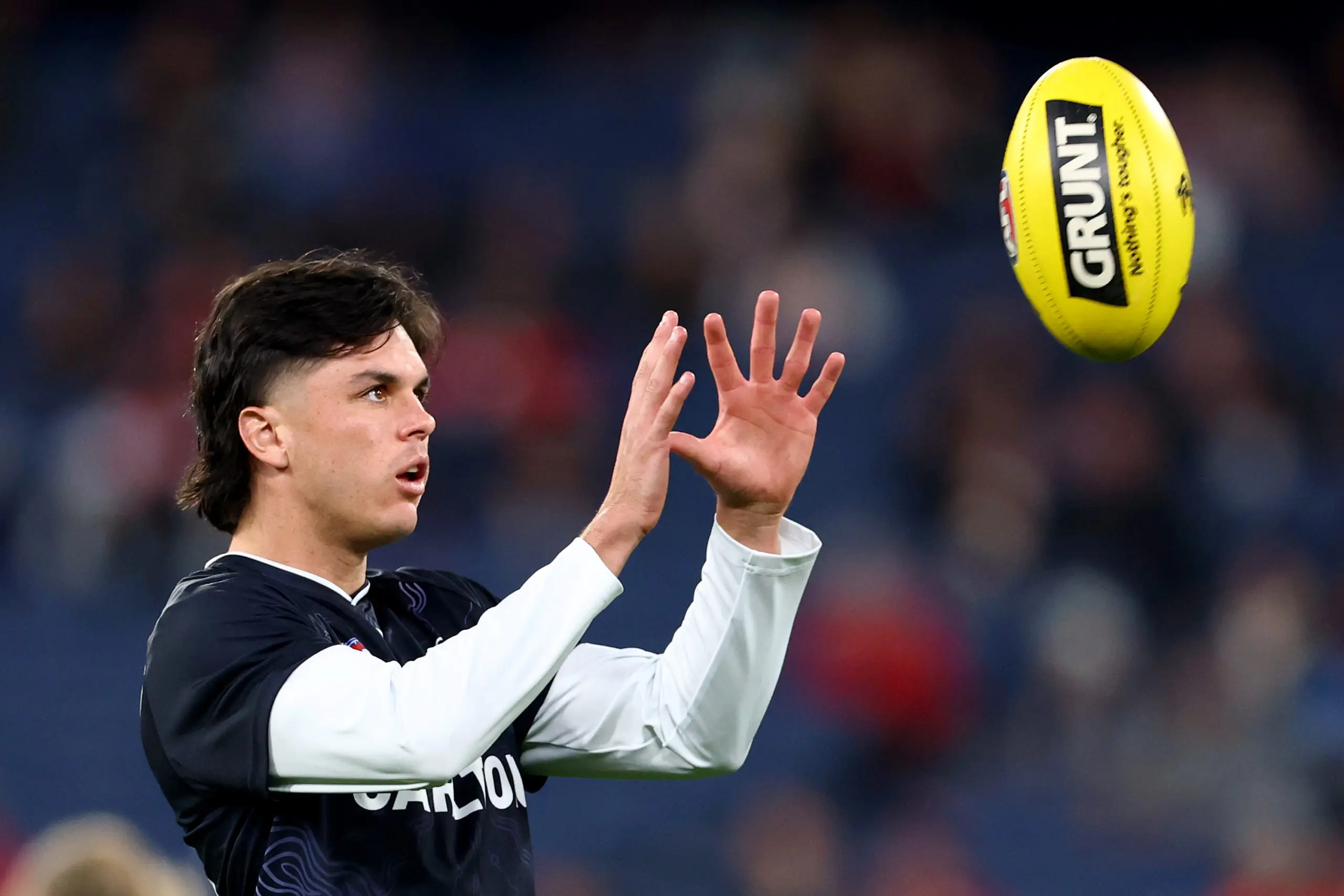 MELBOURNE, AUSTRALIA - MAY 09: Elijah Hollands of the Blues warms up ahead of the round nine AFL match between St Kilda Saints and Carlton Blues at Melbourne Cricket Ground, on May 09, 2025, in Melbourne, Australia. (Photo by Josh Chadwick/AFL Photos/Getty Images)