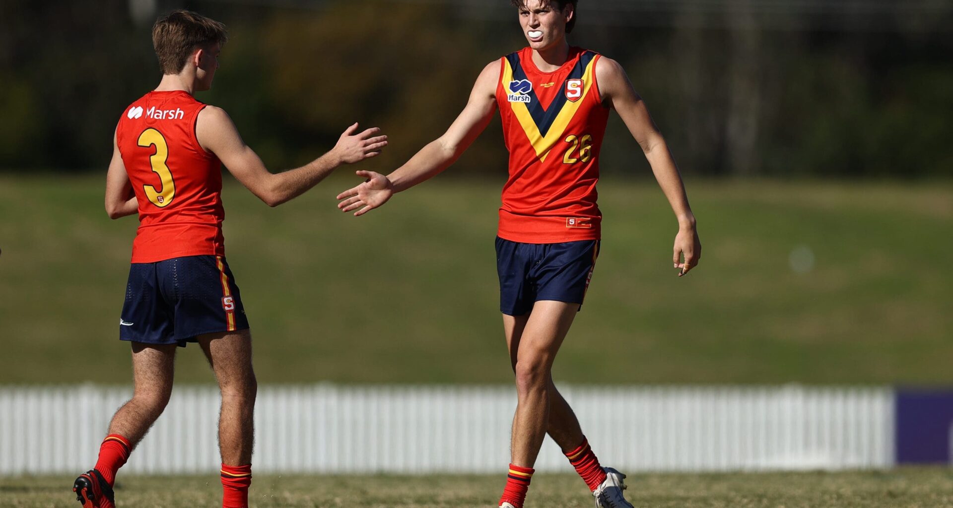 SYDNEY, AUSTRALIA - JUNE 01: Mitchell Marsh (R) of South Australia celebrates kicking a goal with saduring the Marsh AFL National Championships U18 Boys match between Allies and South Australia at Blacktown International Sportspark on June 01, 2025 in Sydney, Australia. (Photo by Jason McCawley/AFL Photos/via Getty Images)
