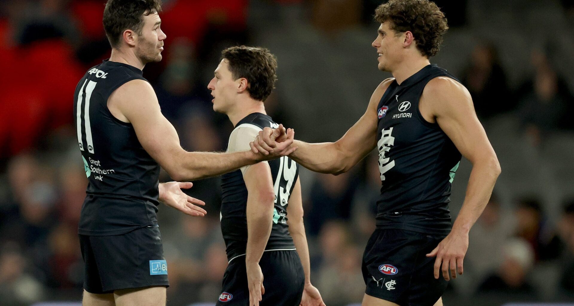 MELBOURNE, AUSTRALIA - JULY 10: Mitch McGovern of the Blues is congratulated by Charlie Curnow after kicking a goal during the round 18 AFL match between Carlton Blues and Brisbane Lions at Marvel Stadium on July 10, 2025 in Melbourne, Australia. (Photo by Robert Cianflone/Getty Images)