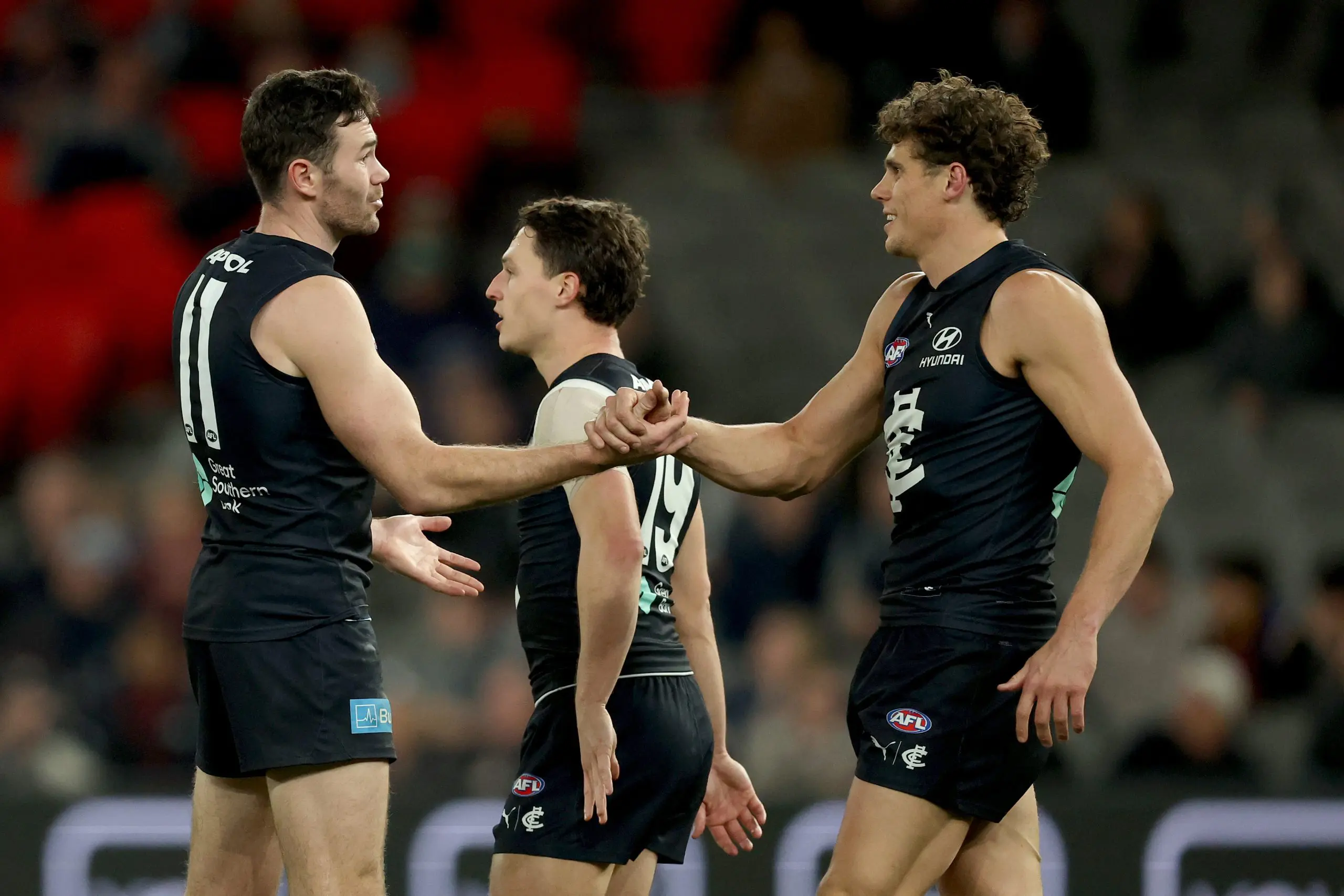 MELBOURNE, AUSTRALIA - JULY 10: Mitch McGovern of the Blues is congratulated by Charlie Curnow after kicking a goal during the round 18 AFL match between Carlton Blues and Brisbane Lions at Marvel Stadium on July 10, 2025 in Melbourne, Australia. (Photo by Robert Cianflone/Getty Images)