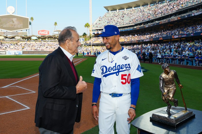 Joe Torre and Mookie Betts talk during the Roberto Clemente Award presentation
