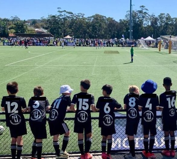 young football payers watching a game