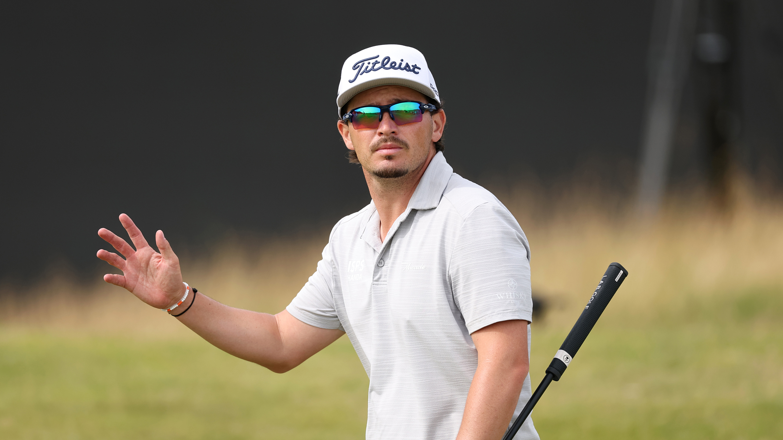 Ewen Ferguson waves to the camera during the 2025 Genesis Scottish Open