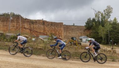 Cole Davis (Project Echelon) on a climb at US Gravel Nationals between Alexey Vermeulen (ENVE) on the front with Cobe Freeburn (MAAP Trek) on the back
