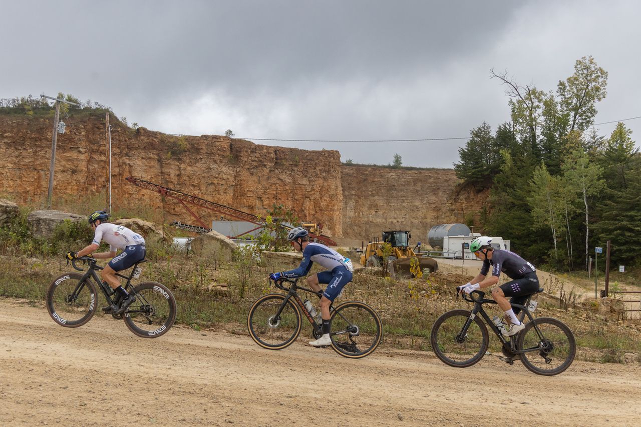 Cole Davis (Project Echelon) on a climb at US Gravel Nationals between Alexey Vermeulen (ENVE) on the front with Cobe Freeburn (MAAP Trek) on the back