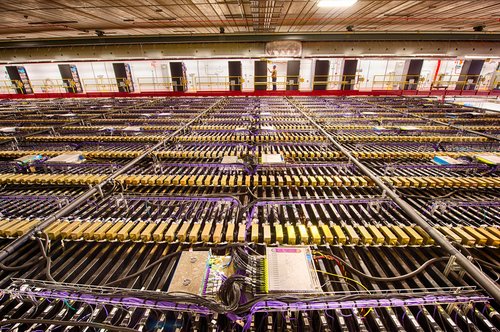 The NOvA far detector in Minnesota, made of 344,000 individual cells each 50 feet long and filled with a mixture of mineral oil and dissolved light-emitting chemicals. It's endless rows of purple and gold blocks.