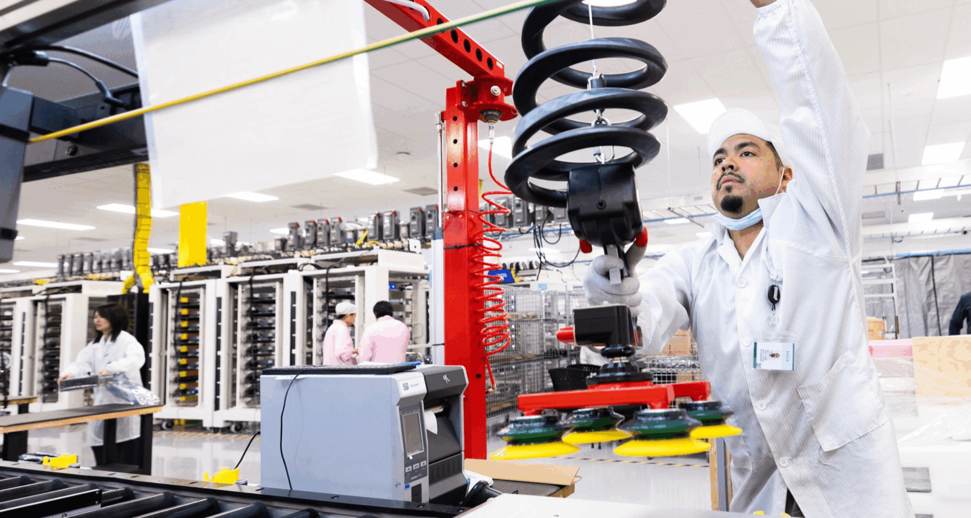 A worker at Apple's Houston facility works on an assembly line.