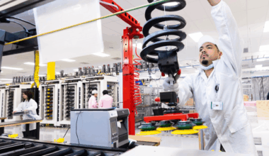A worker at Apple's Houston facility works on an assembly line.