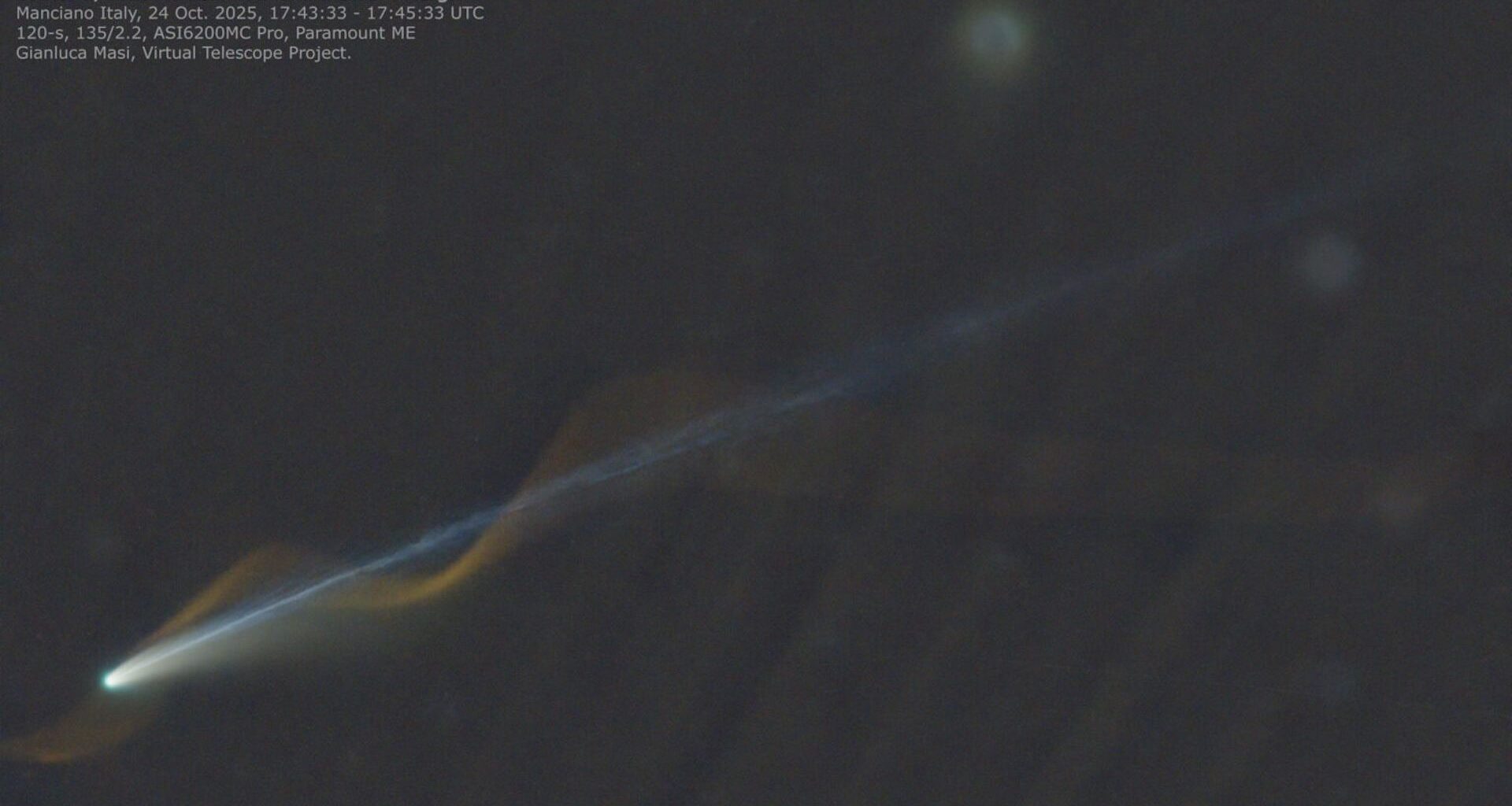 An image of a comet with a straight blue tail and a red meteor corkscrewing around the comet