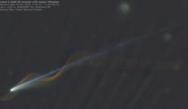 An image of a comet with a straight blue tail and a red meteor corkscrewing around the comet