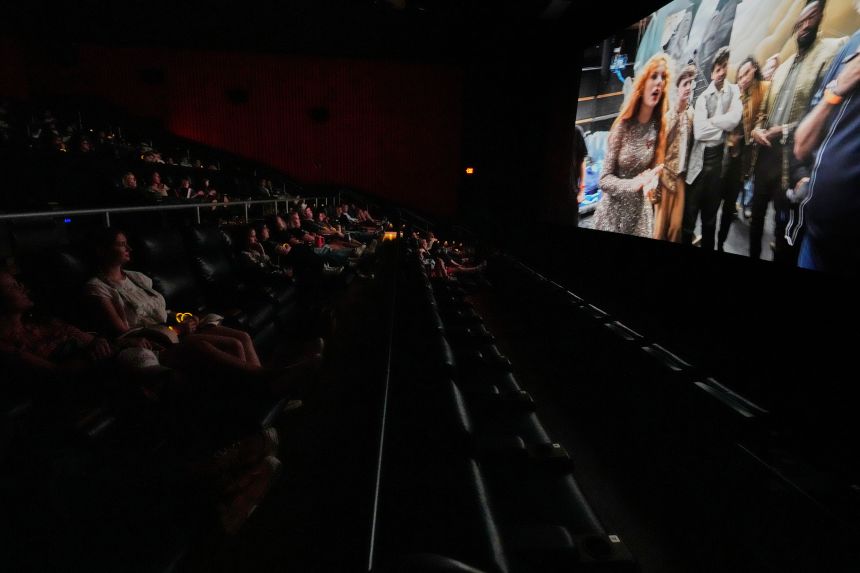 Fans watch a release party film for Taylor Swift's new album