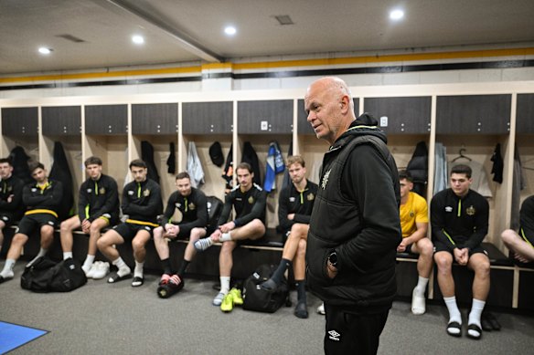 Heidelberg United coach John Anastasiadis speaks to his players at midweek training.