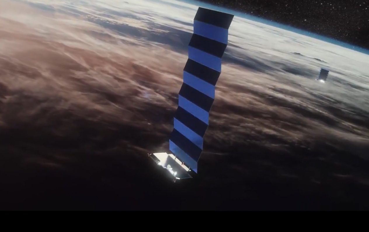 An image showing a satellite above Earth floating in space