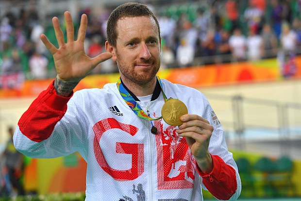 Bradley Wiggins poses with his gold medal