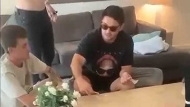 Cameron Munster was filmed with  Storm teammates Brandon Smith and Chris Lewis in a Queensland hotel room with white powder on the table.