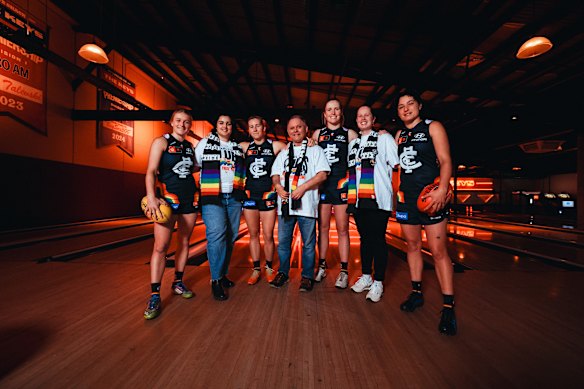 Carlton AFLW players with Carlton Pride president David Gould.