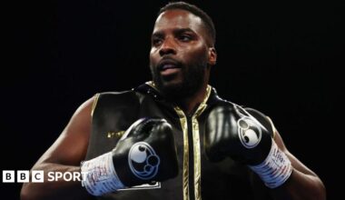 Lawrence Okolie with black boxing gloves on