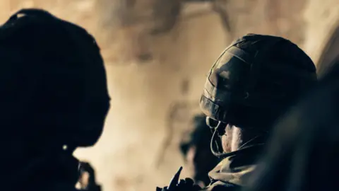 Getty Images Generic image of the back of two soldiers heads