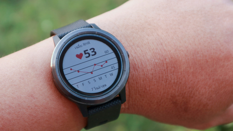 Someone wearing a Garmin Vivoactive watch on the wrist