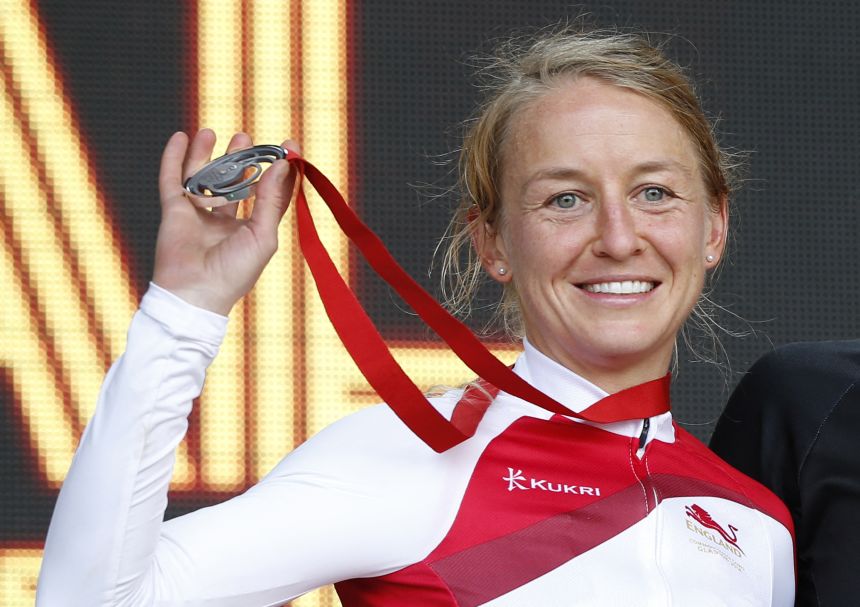 Emma Pooley poses with the silver medal that she won in the individual time trial event at the 2014 Commonwealth Games.