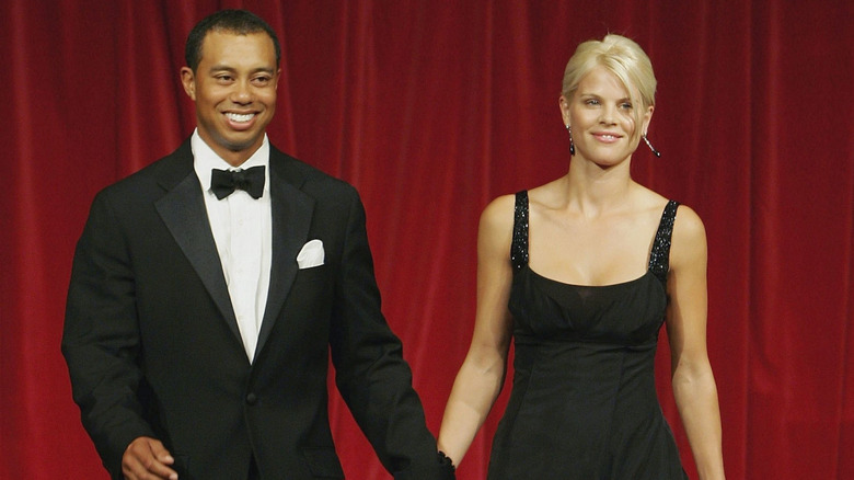 Tiger Woods wearing a tuxedo and Elin Nordegren wearing a black gown in 2006