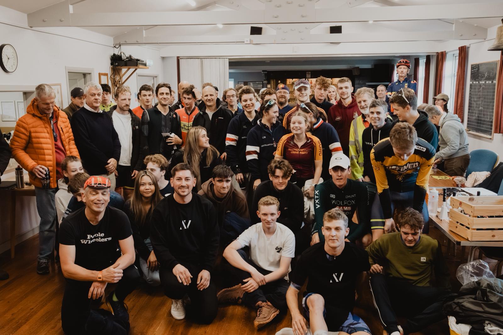 Group of people sit in a village hall