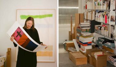 Irma Boom holding a poster in her studio