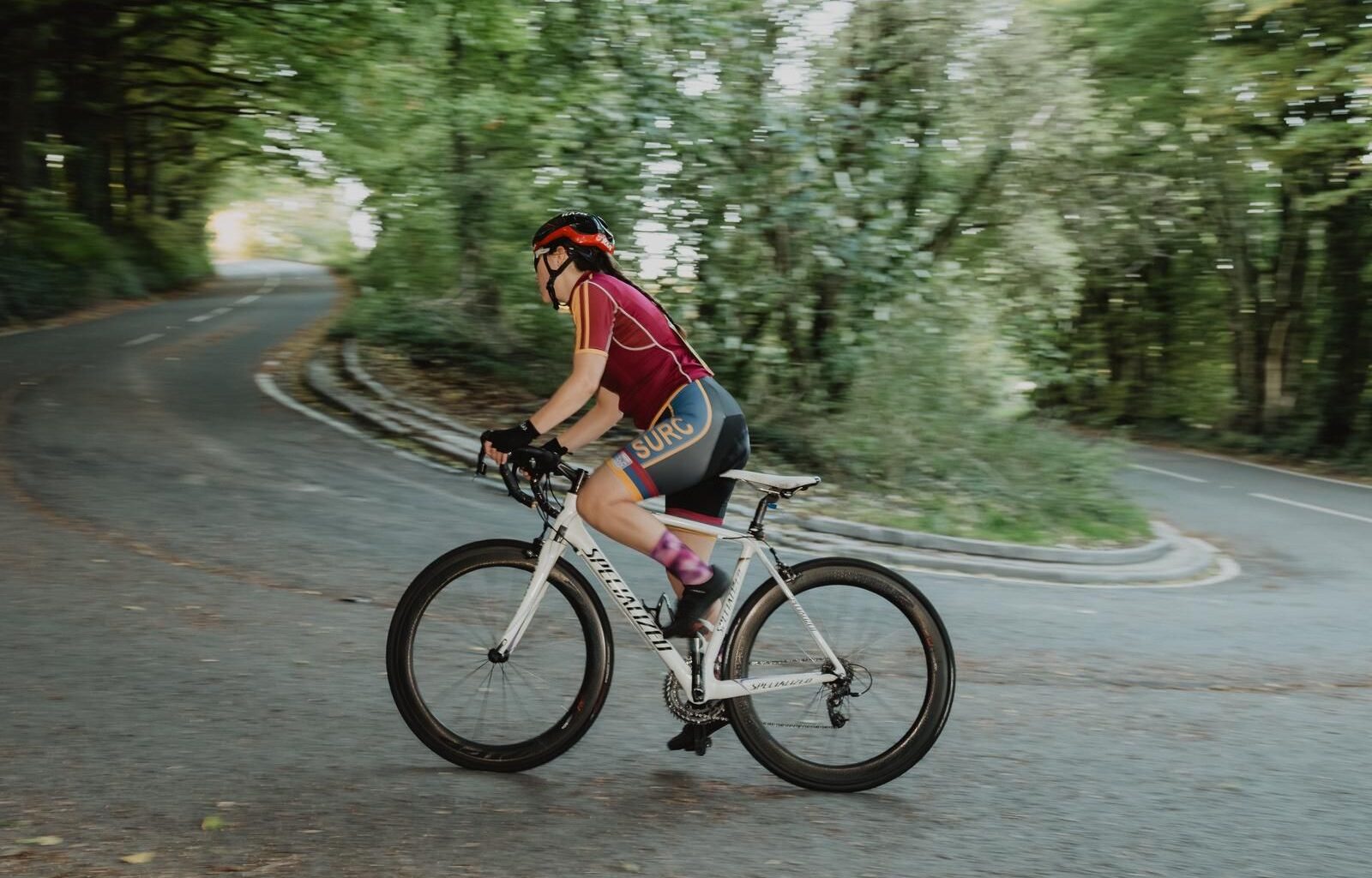 Woman cycles up hill