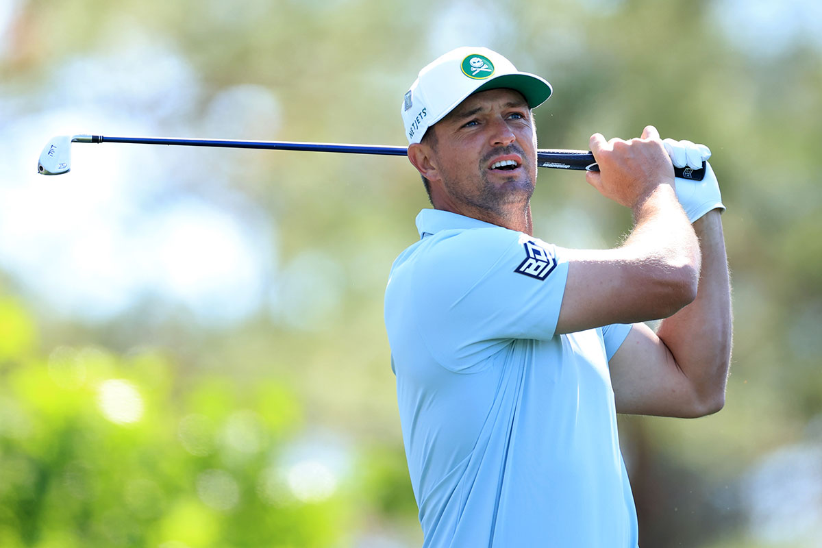 Bryson DeChambeau in the finish position with an iron during The Masters at Augusta National