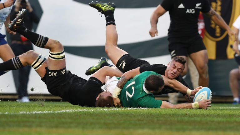 Robbie Henshaw of Ireland crashes over to score his team's fifth try 