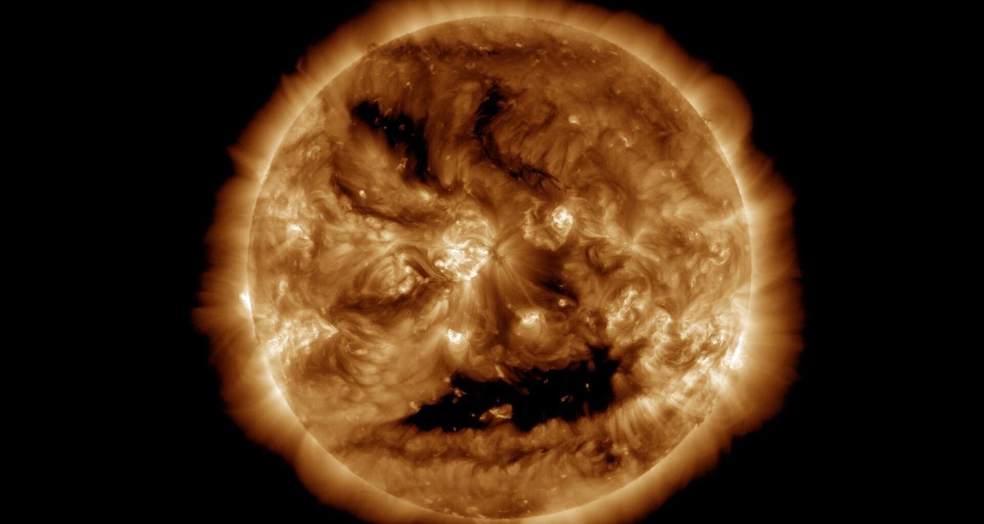 NASA spots a spooky face glowing on the sun just in time for Halloween (photo)